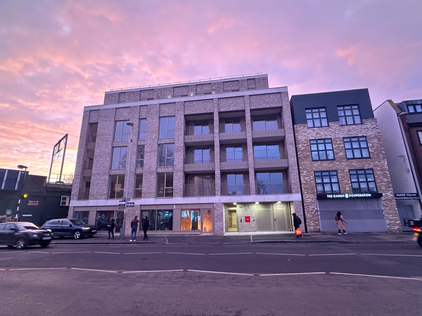 A Redwood Residences managed apartment block in East London at dusk
